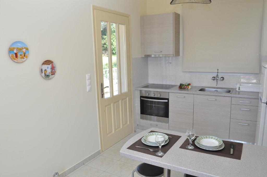 A kitchen or kitchenette at Polymnia Apartments Lassi