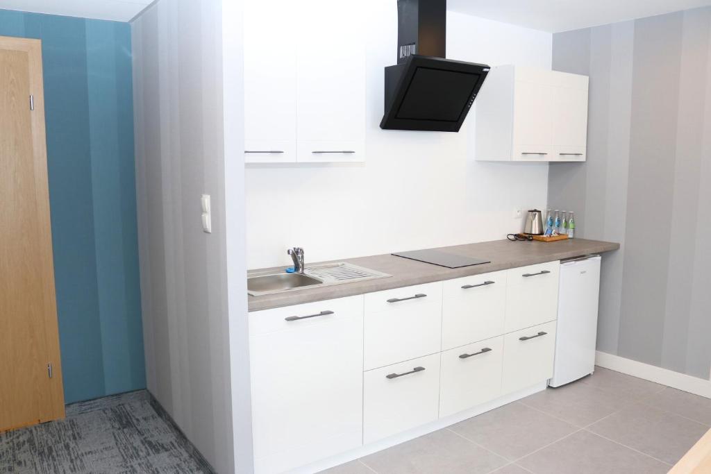 Una cocina o cocineta en Hotel Hel