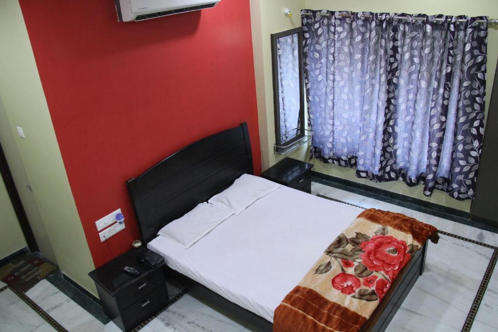 Postel nebo postele na pokoji v ubytování Hotel Gujrat
