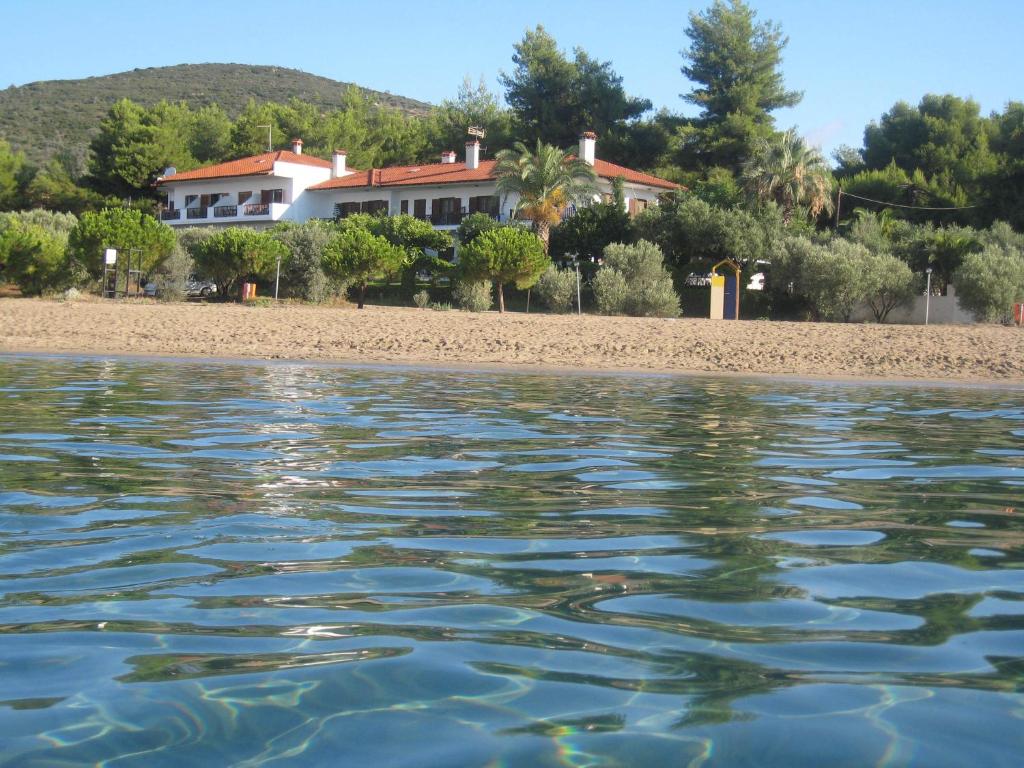 a house on the shore of a beach at Pension Nikos in Psakoudia