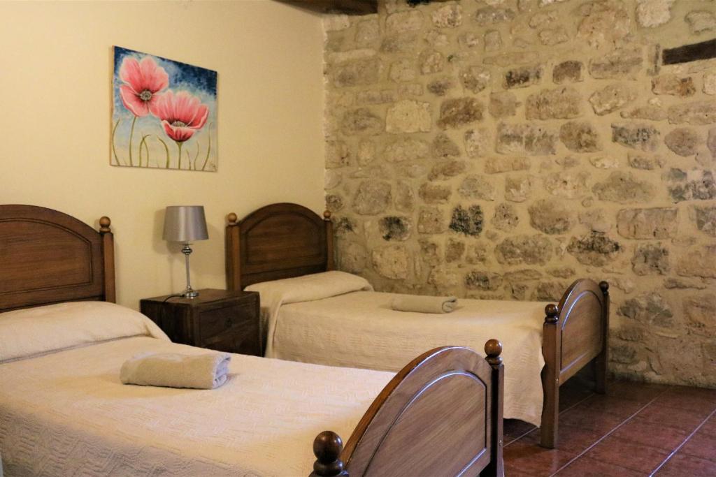 Postel nebo postele na pokoji v ubytování Albergue El Puntido