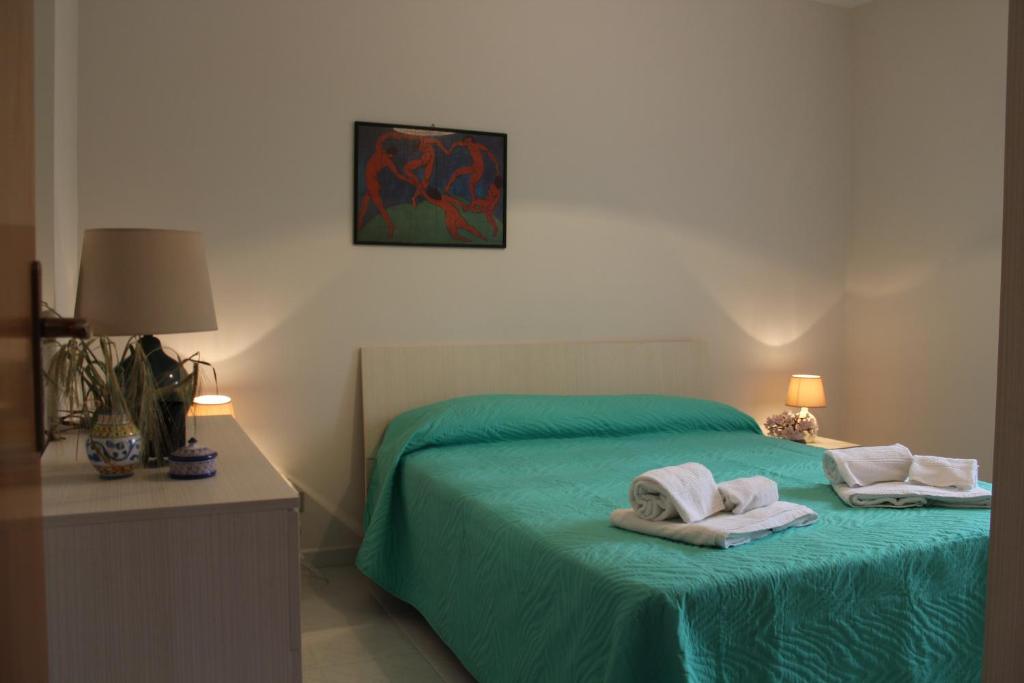 Llit o llits en una habitació de Villa Paola Holidays
