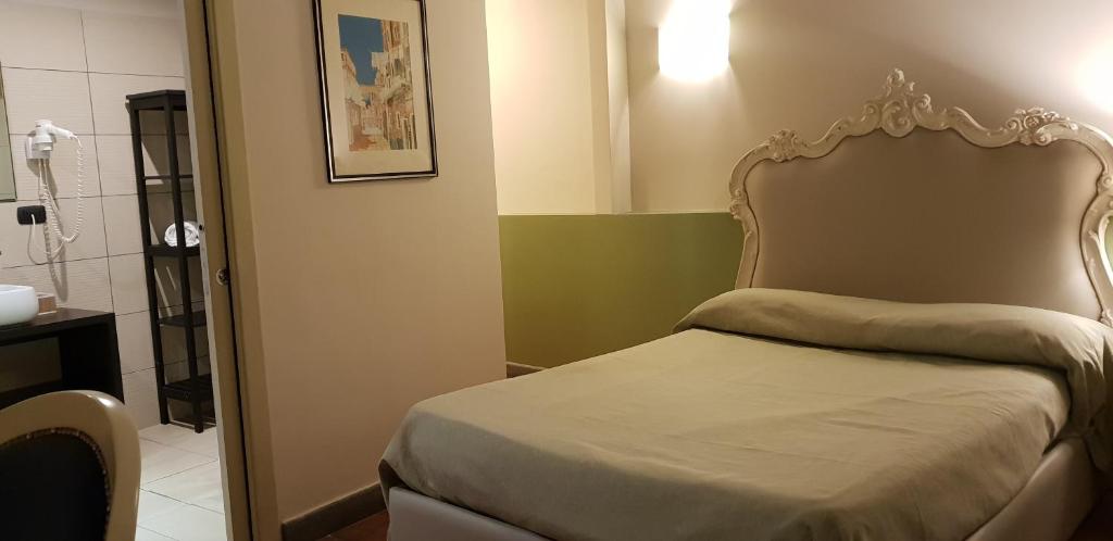מיטה או מיטות בחדר ב-Art & Jazz Hotel
