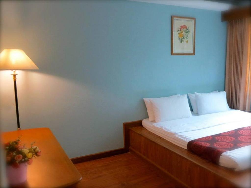 Letto o letti in una camera di Mae Pim Resort Hotel