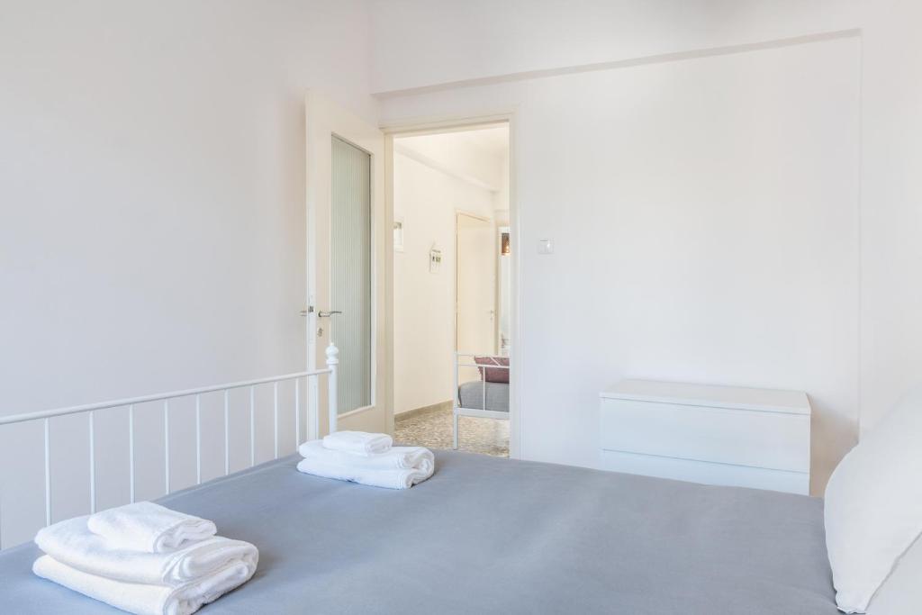 Łóżko lub łóżka w pokoju w obiekcie Mampochi Guesthouse