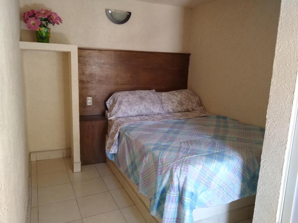 Postel nebo postele na pokoji v ubytování Hotel Cuauhtemoc