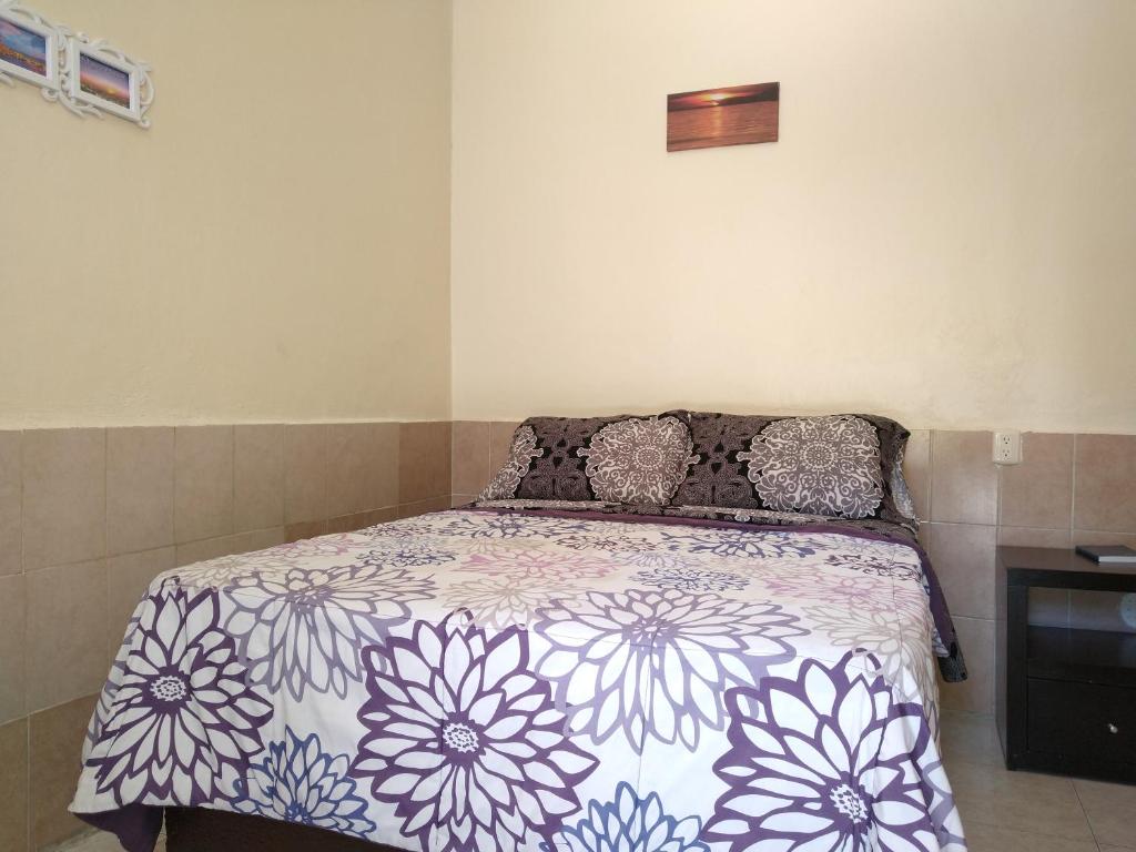 Postel nebo postele na pokoji v ubytování Hotel Cuauhtemoc