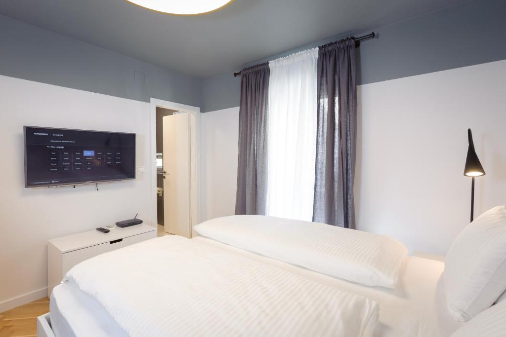 Postel nebo postele na pokoji v ubytování MK Luxury Rooms