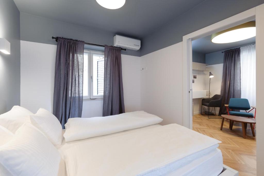 Voodi või voodid majutusasutuse MK Luxury Rooms toas