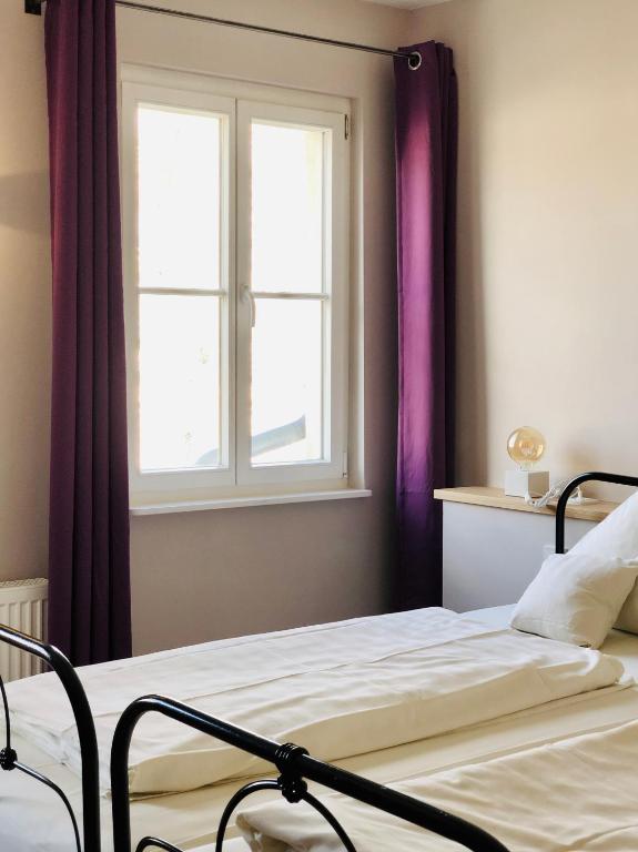 Postel nebo postele na pokoji v ubytování Hotel Alexander
