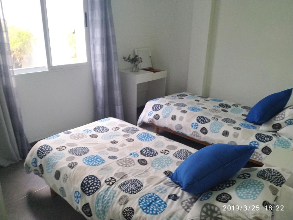 Postel nebo postele na pokoji v ubytování Apartamentos El Patio