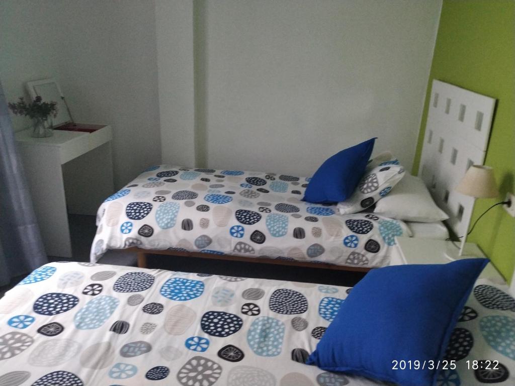 Postel nebo postele na pokoji v ubytování Apartamentos El Patio