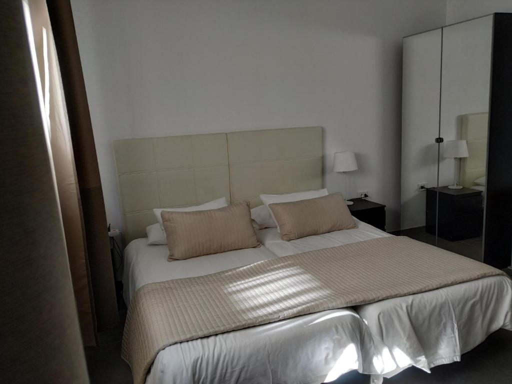 Postel nebo postele na pokoji v ubytování Apartamentos El Patio