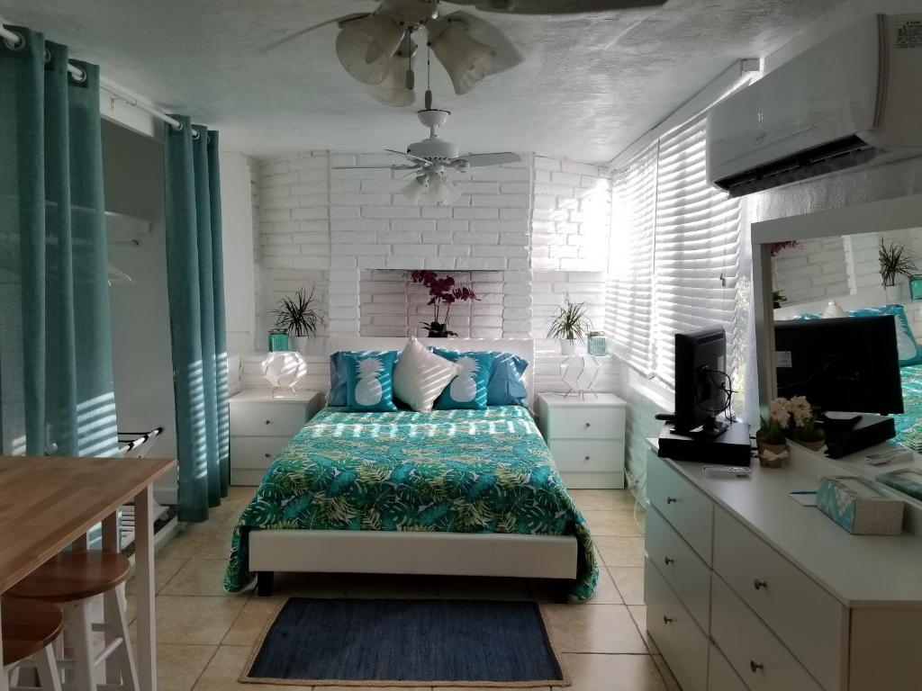 
a bedroom with a large bed and a large window at Beachbound in Miami
