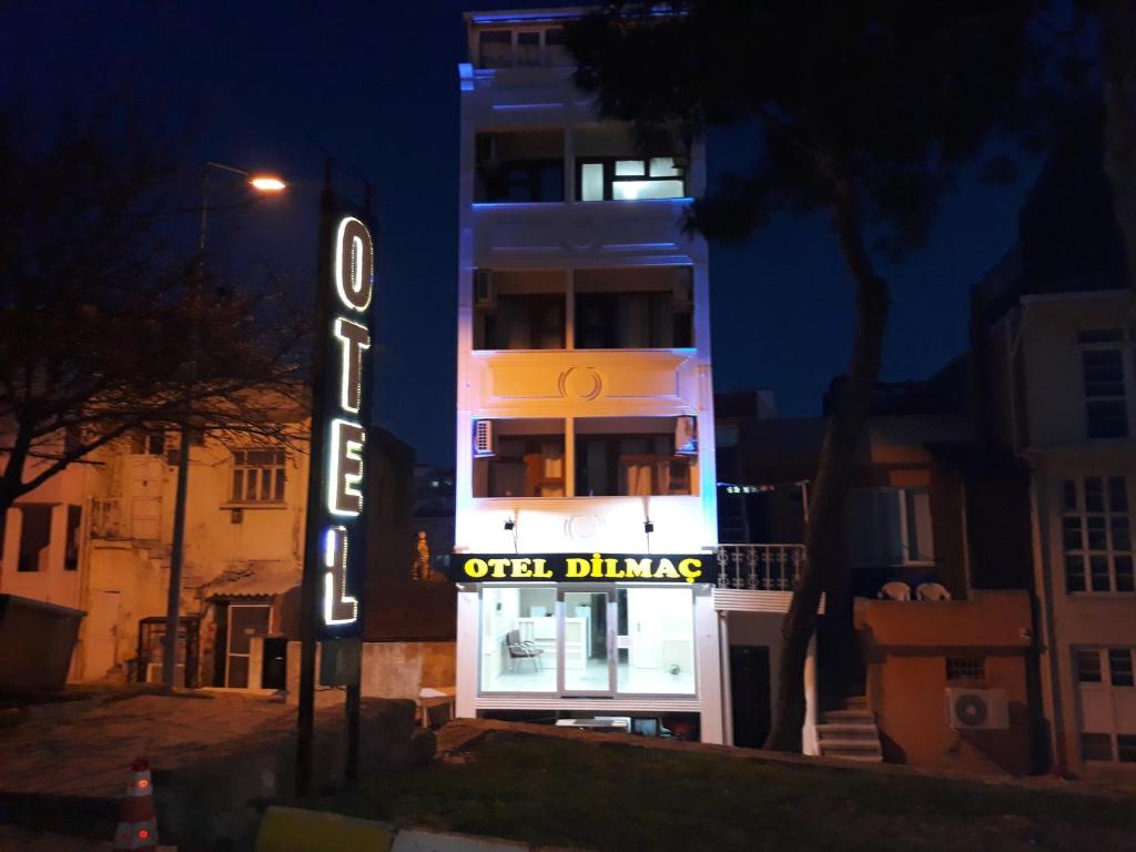 a hotel sign in front of a building at night at Dilmac Hotel in Gelibolu