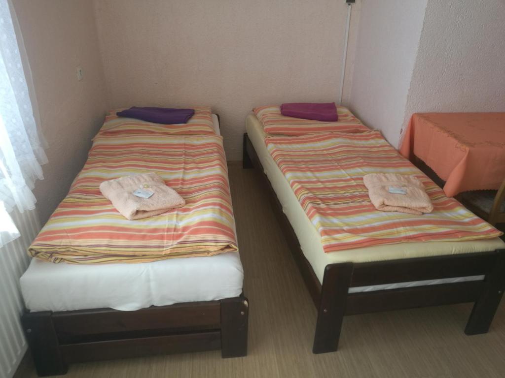 Postel nebo postele na pokoji v ubytování Hotel Chata