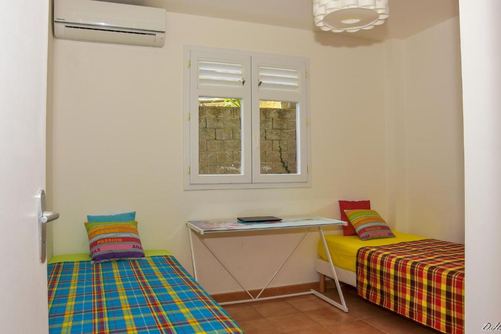Postel nebo postele na pokoji v ubytování Villa Nord-Plage