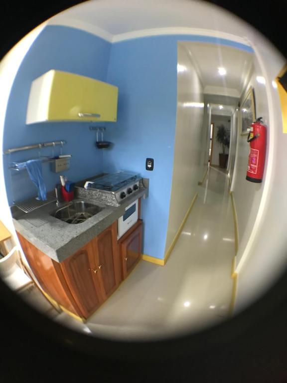 a view of a kitchen with a fire hydrant at Hotel Pousada LG in Breves