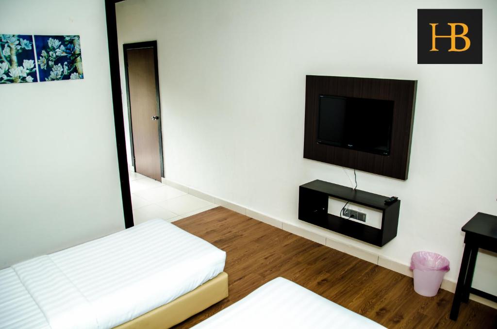 TV a/nebo společenská místnost v ubytování H Benjamin Residence