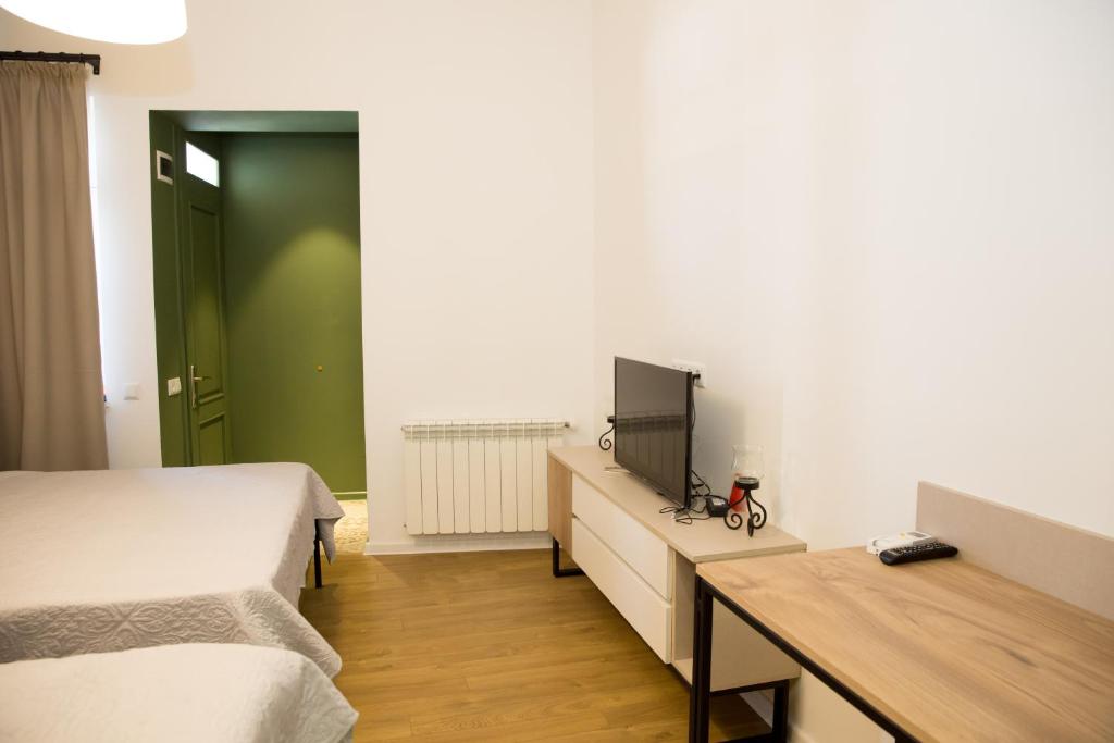 Postel nebo postele na pokoji v ubytování Meidan Suites