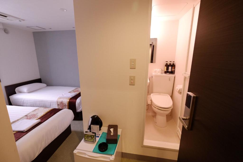 Koupelna v ubytování Tabata Oji Hotel