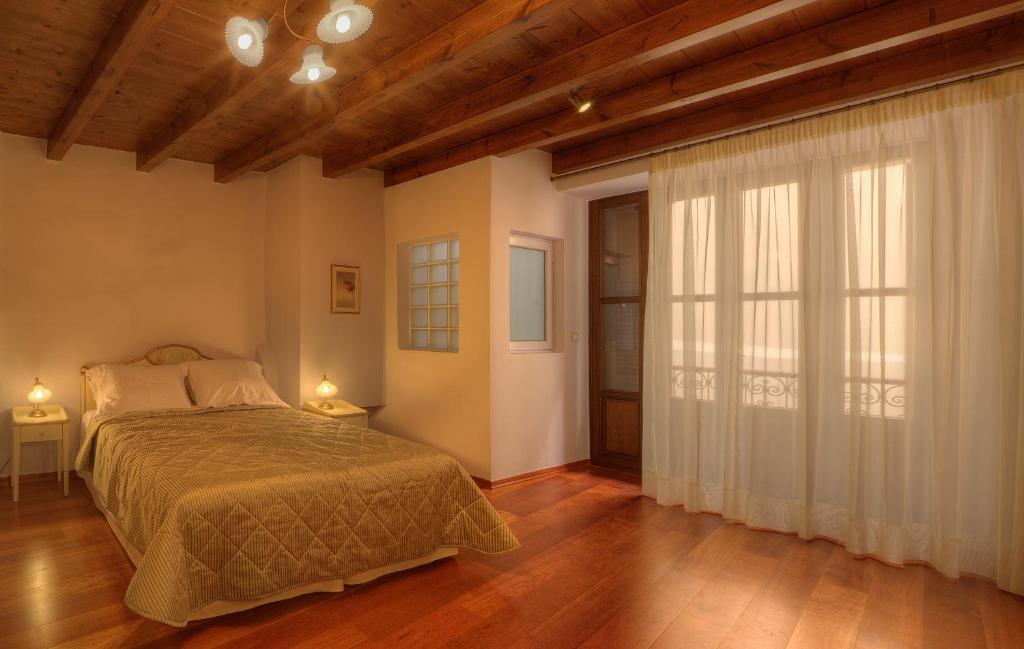 Postel nebo postele na pokoji v ubytování Palazzo Duca
