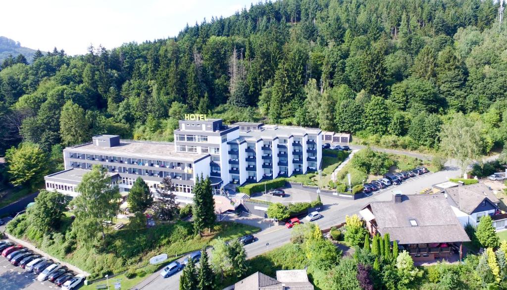 an aerial view of a hotel in the mountains at Hotel AM Fang in Bad Laasphe