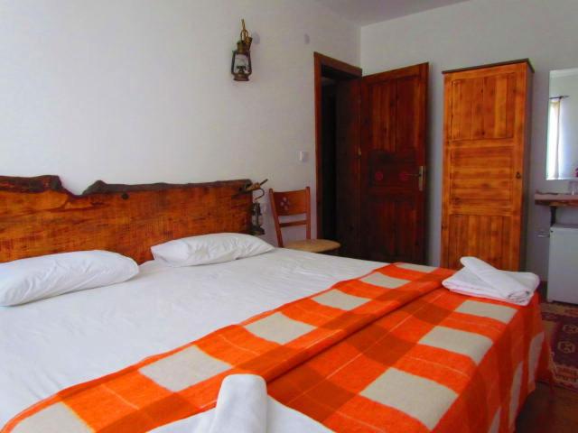 Postel nebo postele na pokoji v ubytování Amazon Petite Palace