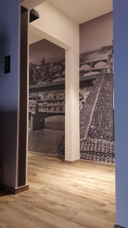 Hotel La Firenze Sogna, a room with a painting of a stadium on the wall at La Firenze Sogna in Florence