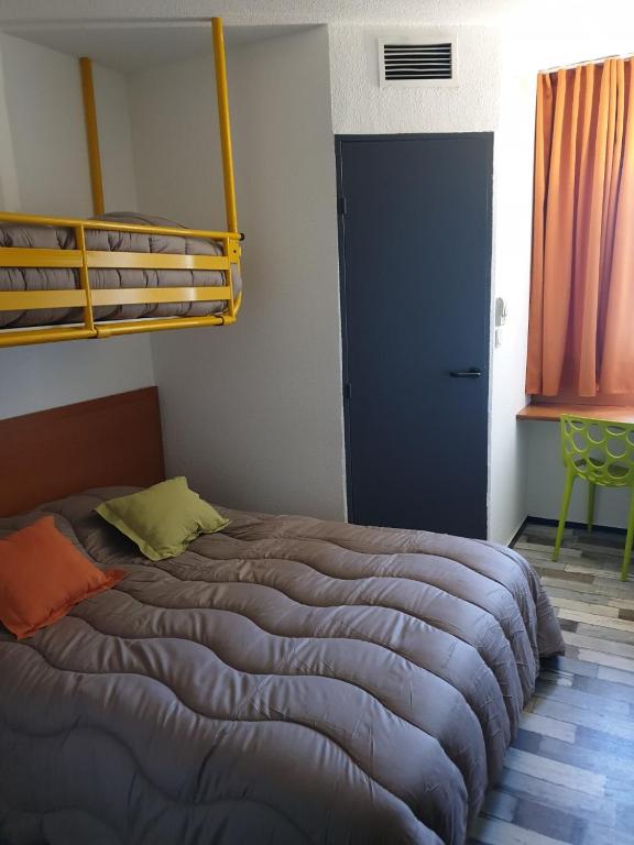 Postel nebo postele na pokoji v ubytování Welcomotel Limoges