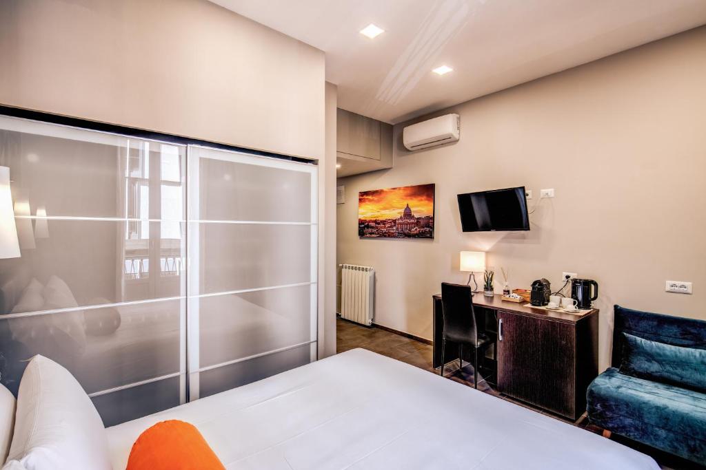 Televízia a/alebo spoločenská miestnosť v ubytovaní H501 Luxury Rooms