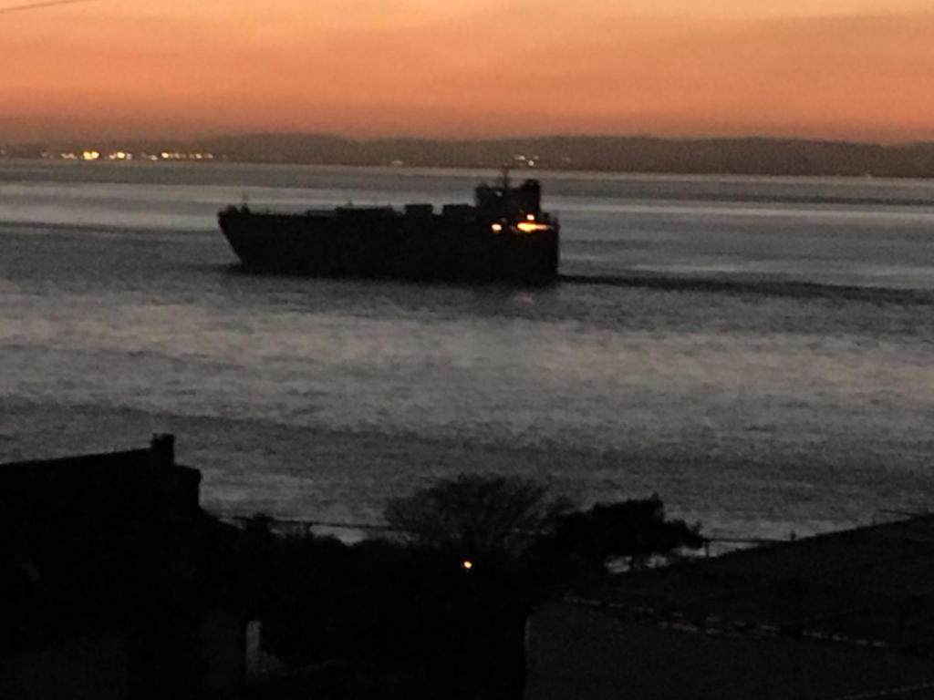 a barge on the water at sunset at The Nook @ Drop Anchor in Portishead