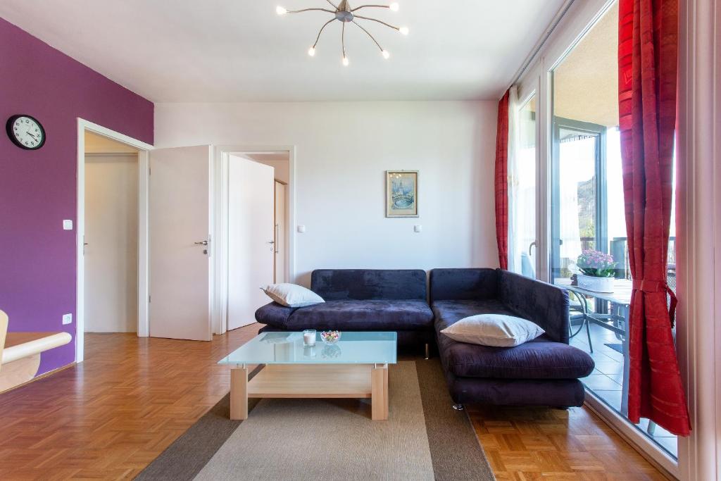 a living room with a couch and a coffee table at Couples Getaway in Bohinj