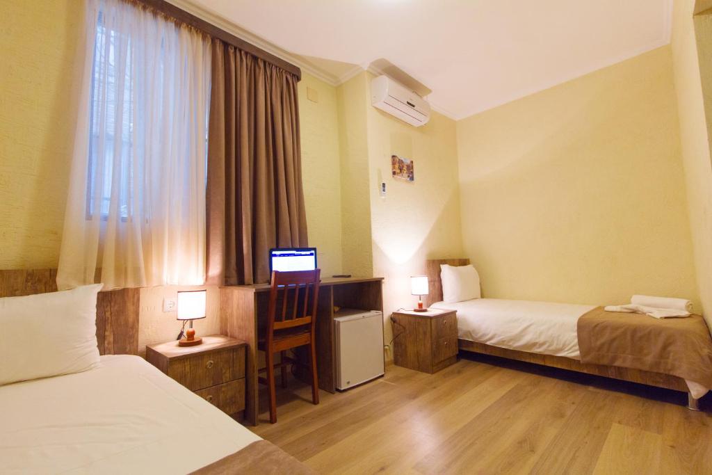 Postel nebo postele na pokoji v ubytování Hotel Tabi