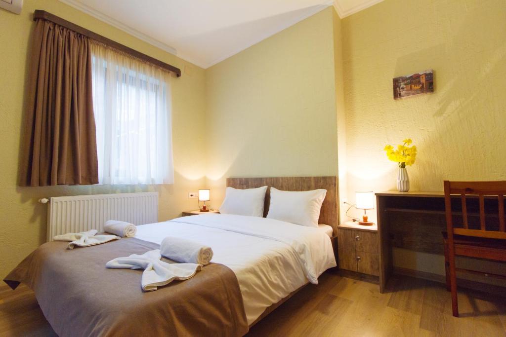 Postel nebo postele na pokoji v ubytování Hotel Tabi