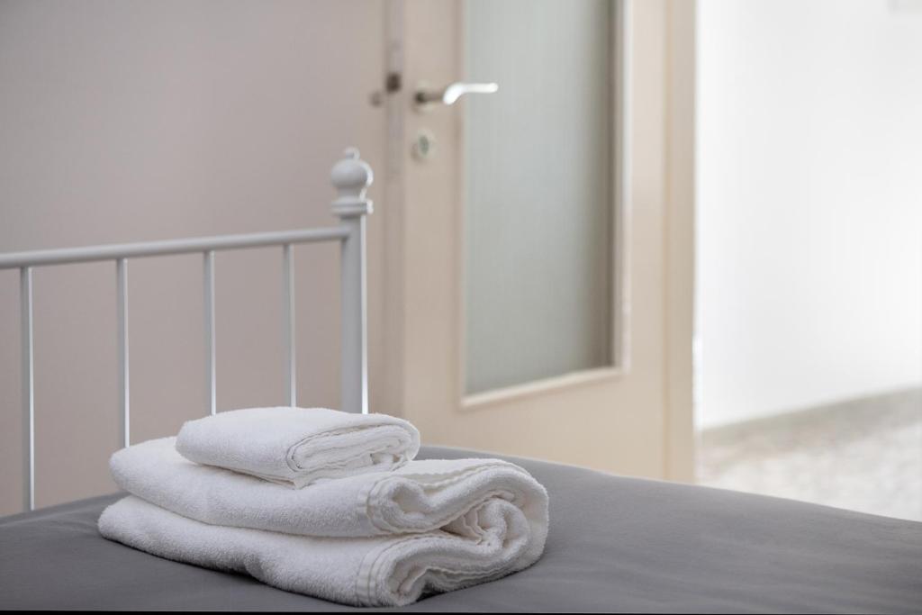 Łóżko lub łóżka w pokoju w obiekcie Mampochi Guesthouse