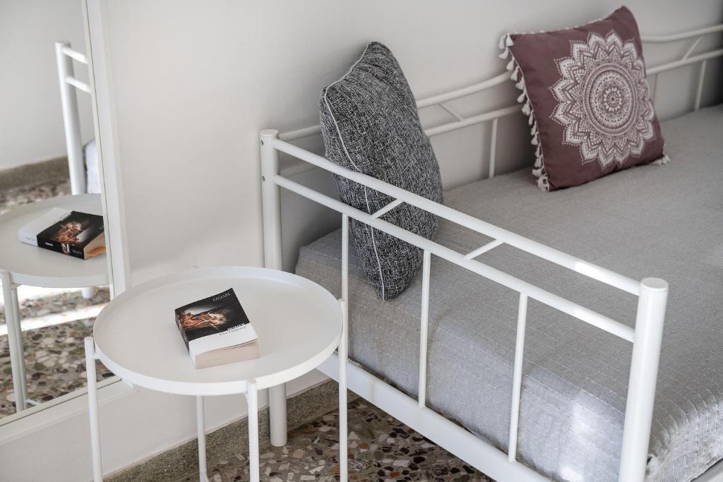 Łóżko lub łóżka w pokoju w obiekcie Mampochi Guesthouse