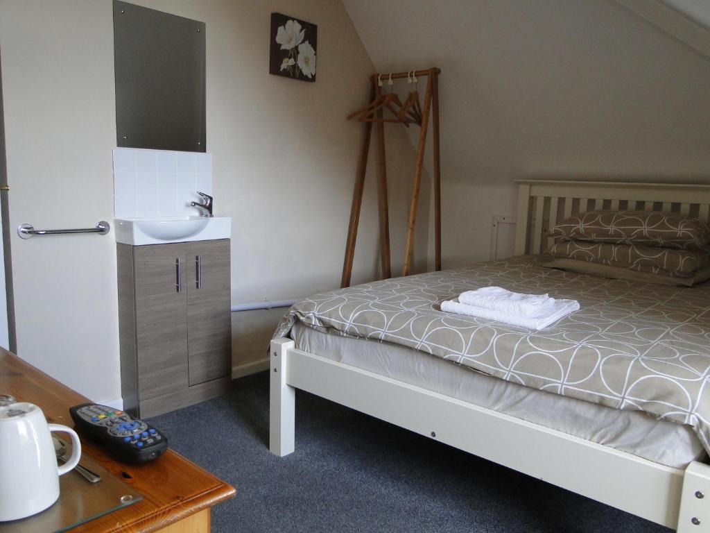 Postel nebo postele na pokoji v ubytování Rockleaze Guesthouse