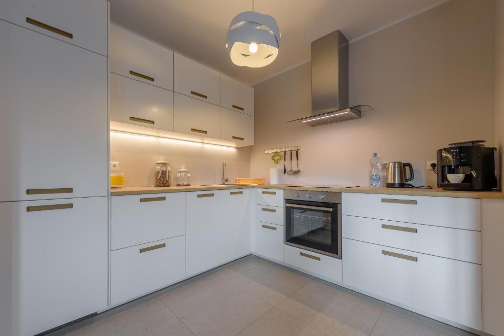 Kuchnia lub aneks kuchenny w obiekcie Apartament Widokowy - 5D Apartamenty