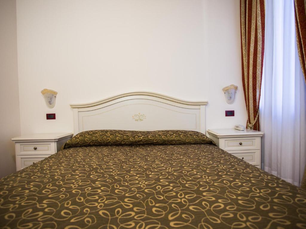 Postel nebo postele na pokoji v ubytování Locanda Ca' Lucrezia