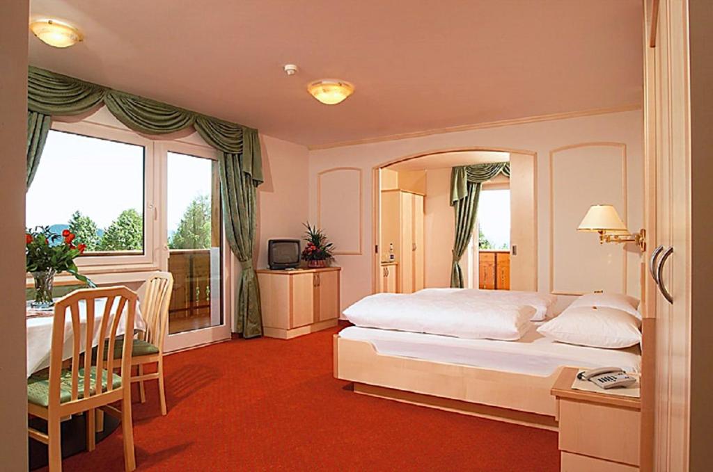 Postel nebo postele na pokoji v ubytování Hotel Sonnenheim