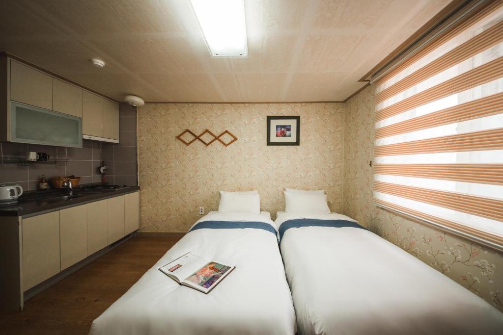 Postel nebo postele na pokoji v ubytování Jungmun Resort Jeju