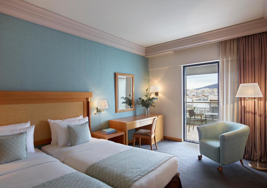 Postel nebo postele na pokoji v ubytování Athens Zafolia Hotel