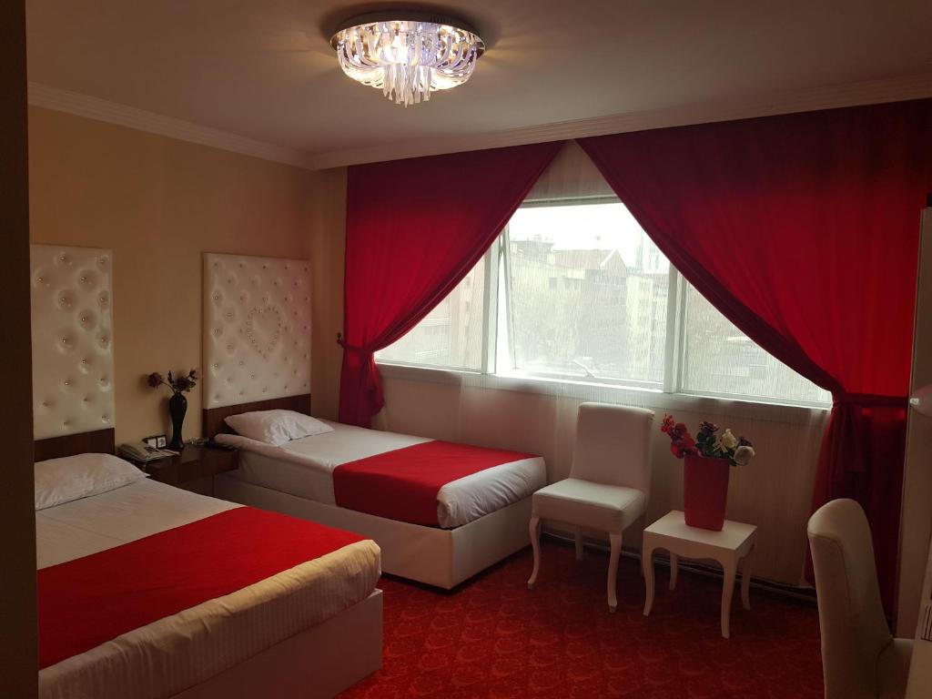 Кровать или кровати в номере Ismira Hotel Ankara