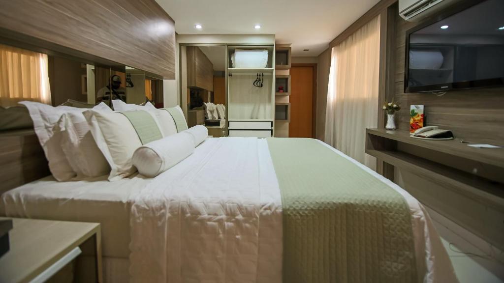 Postel nebo postele na pokoji v ubytování Rapport Hotel
