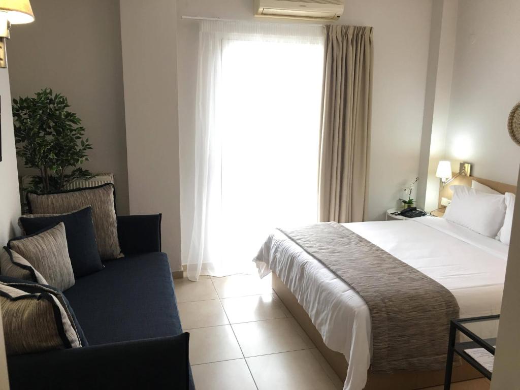 Postel nebo postele na pokoji v ubytování Maison Hotel