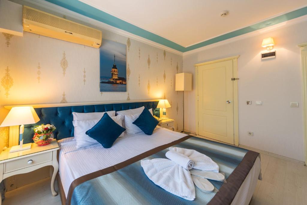 Postel nebo postele na pokoji v ubytování Viva Deluxe Hotel