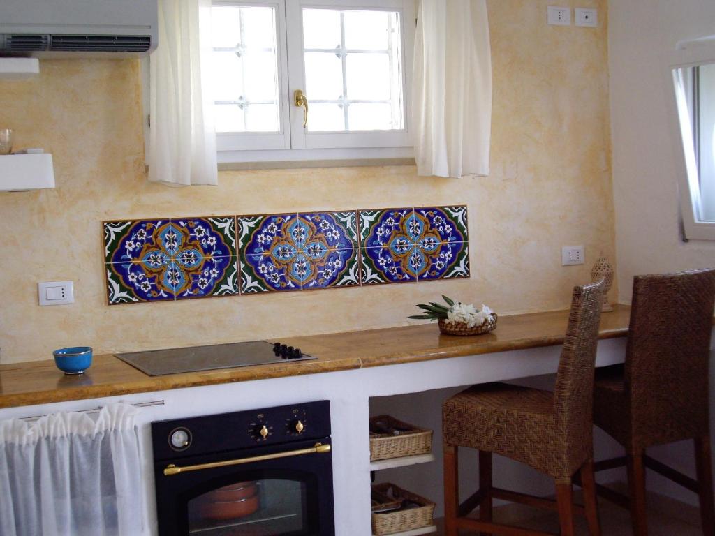 A kitchen or kitchenette at Porta D'Oriente Suite