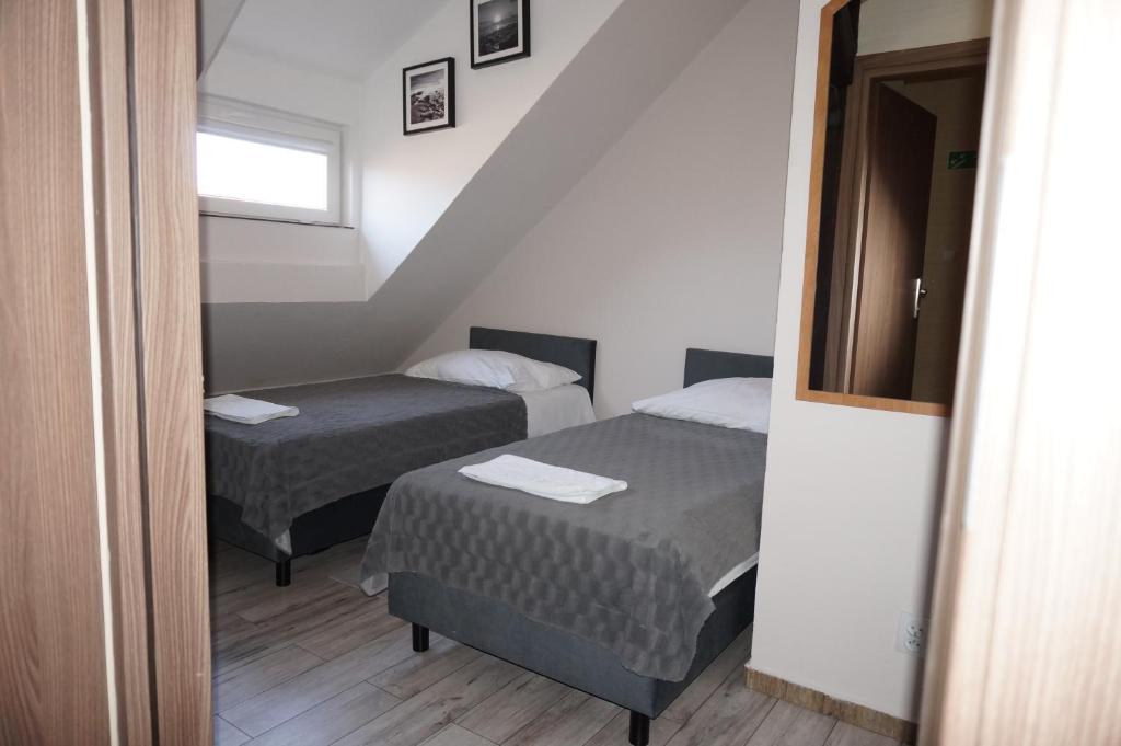 Postel nebo postele na pokoji v ubytování Sejf House