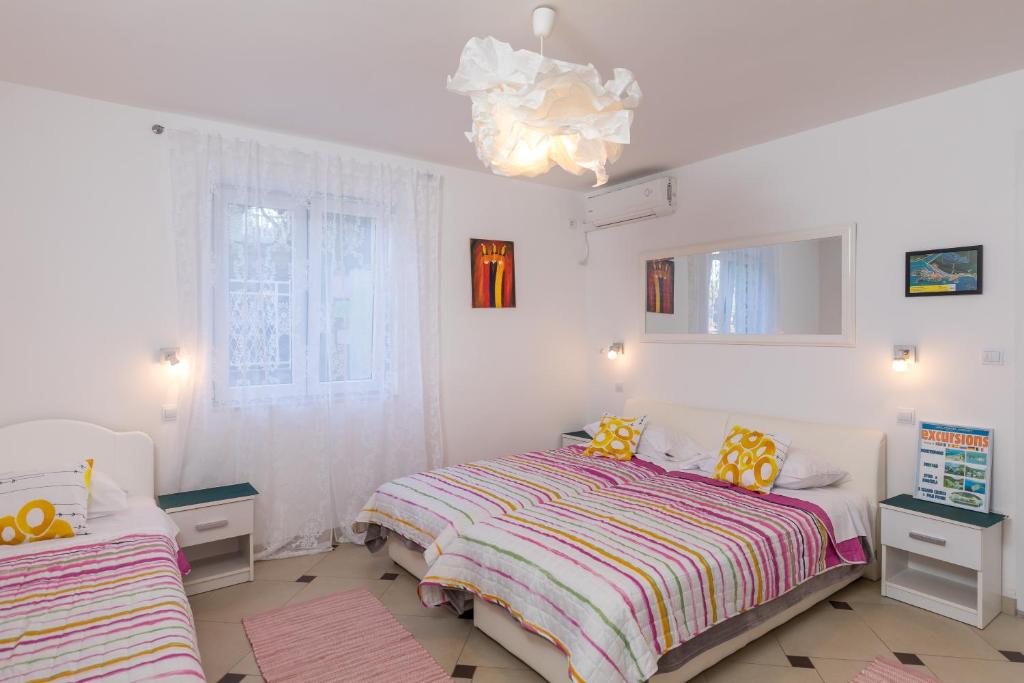 Postel nebo postele na pokoji v ubytování Apartments Lile